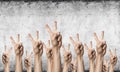 Row of man hands showing victory gesture Royalty Free Stock Photo