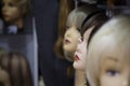 A row of mannequins women on a shelf in a wig shop Royalty Free Stock Photo