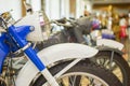 Row of many motorcycle for sale. Motorcycles standing in the row at a store, closeup. Motobikes in a row Royalty Free Stock Photo