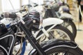 Row of many motorcycle for sale. Motorcycles standing in the row at a store, closeup. Motobikes in a row Royalty Free Stock Photo