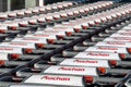 Row of many shopping carts branded with the logo of Auchan Royalty Free Stock Photo