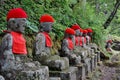 Row of many stony sculptures of buddhas (Kanmangafuchi) in Nikko, Japan Royalty Free Stock Photo