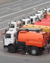 Row of many Watering cars on road