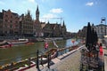 Row of medieval buildings along the tourist boats floating on the Lys River dutch: Leie