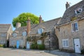 A row of medieval houses with brickstone and flagstone roofs in Corfe castle village Royalty Free Stock Photo