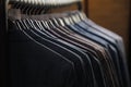 Rows of men`s suit jackets in suitshop Royalty Free Stock Photo