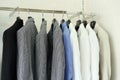 Row of men's suit jackets hanging in shop Royalty Free Stock Photo