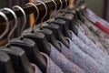 A row of men\'s suits, jackets hanging on a rack for display Royalty Free Stock Photo