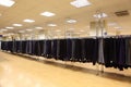 Row men trousers on hangers in shop Royalty Free Stock Photo