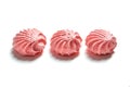 Row of Meringue. Meringues kisses in pink color. Airy and practically weightless biscuits Royalty Free Stock Photo