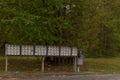 A row of metal grouped mailboxes for an apartment complex