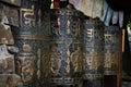 A row of metal tibetan buddhist prayer wheels. Royalty Free Stock Photo