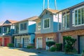 Row of modern houses in the historic districts of downtown san francisco california with sutro tower visible in sky Royalty Free Stock Photo