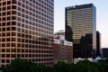 Row of modern office buildings reflecting sunset above a city park in downtown Los Angeles Royalty Free Stock Photo