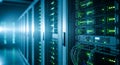 Row of modern server racks with blinking green lights inside dark data center room creating high tech atmosphere Royalty Free Stock Photo