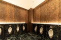 Row of modern urinals men public toilet room in public toilet, restroom in restaurant or hotel or shopping mall, interior Royalty Free Stock Photo