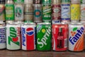 The row of most popular soft drinks on the world in retro aluminium cans Pepsi, Fanta, Cola, 7-up, Sprite with a background of