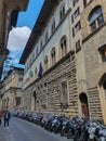 row of motorbikes parked in via del Proconsolo in Florence Royalty Free Stock Photo