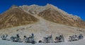 Row of motorcycles in front of the Ladakh range, India
