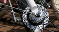 Row multicolored bicycle wheels closeup