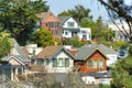 Row of multicolored timber houses in downtown San Francisco California with trees in yards in the neighborhood Royalty Free Stock Photo