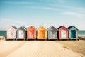 Row of multicolored wooden beach huts sand blue sky. Summer vacation relaxation concept