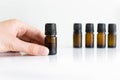 Bottles of essential oils display. White background. Natural health and medicine