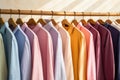 Row Of Neatly Hung Buttonup Shirts In Different Colors. Generative AI Royalty Free Stock Photo