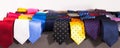 Row of Neckties on hangers in men clothing store Royalty Free Stock Photo