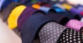 row of Neckties on hangers in men clothing store Royalty Free Stock Photo