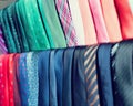 Row of Neckties on hangers in men clothing store Royalty Free Stock Photo