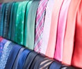 Row of Neckties on hangers in men clothing store Royalty Free Stock Photo