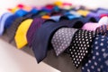 Row of Neckties on hangers in men clothing store Royalty Free Stock Photo