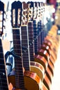 Row of new acoustic guitars in music shop Royalty Free Stock Photo