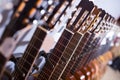 Row of new acoustic guitars in music shop Royalty Free Stock Photo