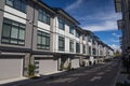 A row of a new townhouses. External facade of a row of colorful modern urban townhouses.brand new houses just after construction o Royalty Free Stock Photo