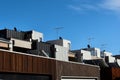 Architectural details showing a row of modern town house apartments on a sunny day and a blue sky. Royalty Free Stock Photo