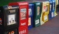 Row of newspaper boxes on the street