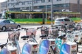 Row of Nextbike brand rental bikes locked on poles on a sidewalk in the city center, Poznan