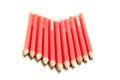 Row of Red Pencils in an Arrow Shape Royalty Free Stock Photo