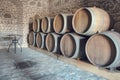 Row of oak barrels in a dry cool wine cellar Royalty Free Stock Photo