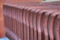 Row ofclay roof tiles, prepared for its insertion on the construction site