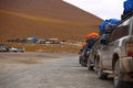 Row of off road vehicles stopped for rest. Adventure in Bolivia highlands in the Andes. Royalty Free Stock Photo