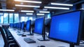 Row of office computers displaying blue screen