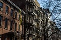 Row of Old Apartment Buildings with Fire Escapes on a Sunny Day in Greenwich Village of New York City Royalty Free Stock Photo