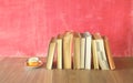 Row of old books, cup of coffee, free copy space Royalty Free Stock Photo