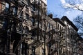Row of Old Brick Apartment Buildings with Fire Escapes along a Residential Street in Greenwich Village of New York City Royalty Free Stock Photo