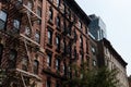 Row of Old Brick Apartment Buildings on the Lower East Side in New York City with Fire Escapes Royalty Free Stock Photo