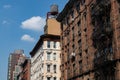 Row of Old Brick Apartment Buildings on the Lower East Side in New York City with Fire Escapes