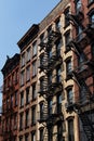 Row of Old Brick Apartment Buildings on the Lower East Side in New York City with Fire Escapes Royalty Free Stock Photo